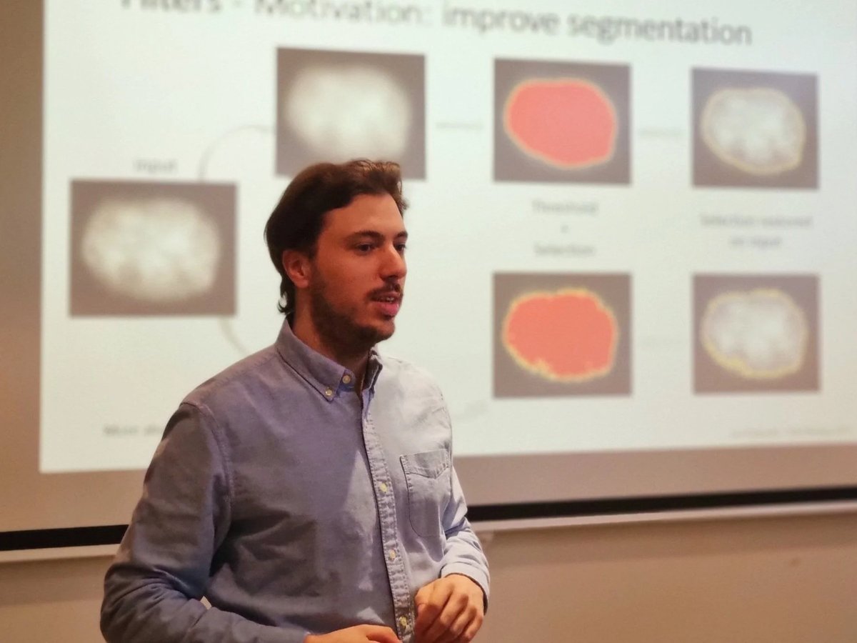 Lior Pytowski teaching an image analysis workshop, in front of slides about improving segmentation